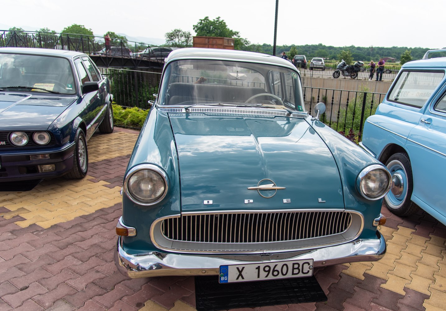 Front view of classic 1950s car with distinctive grille and round headlights