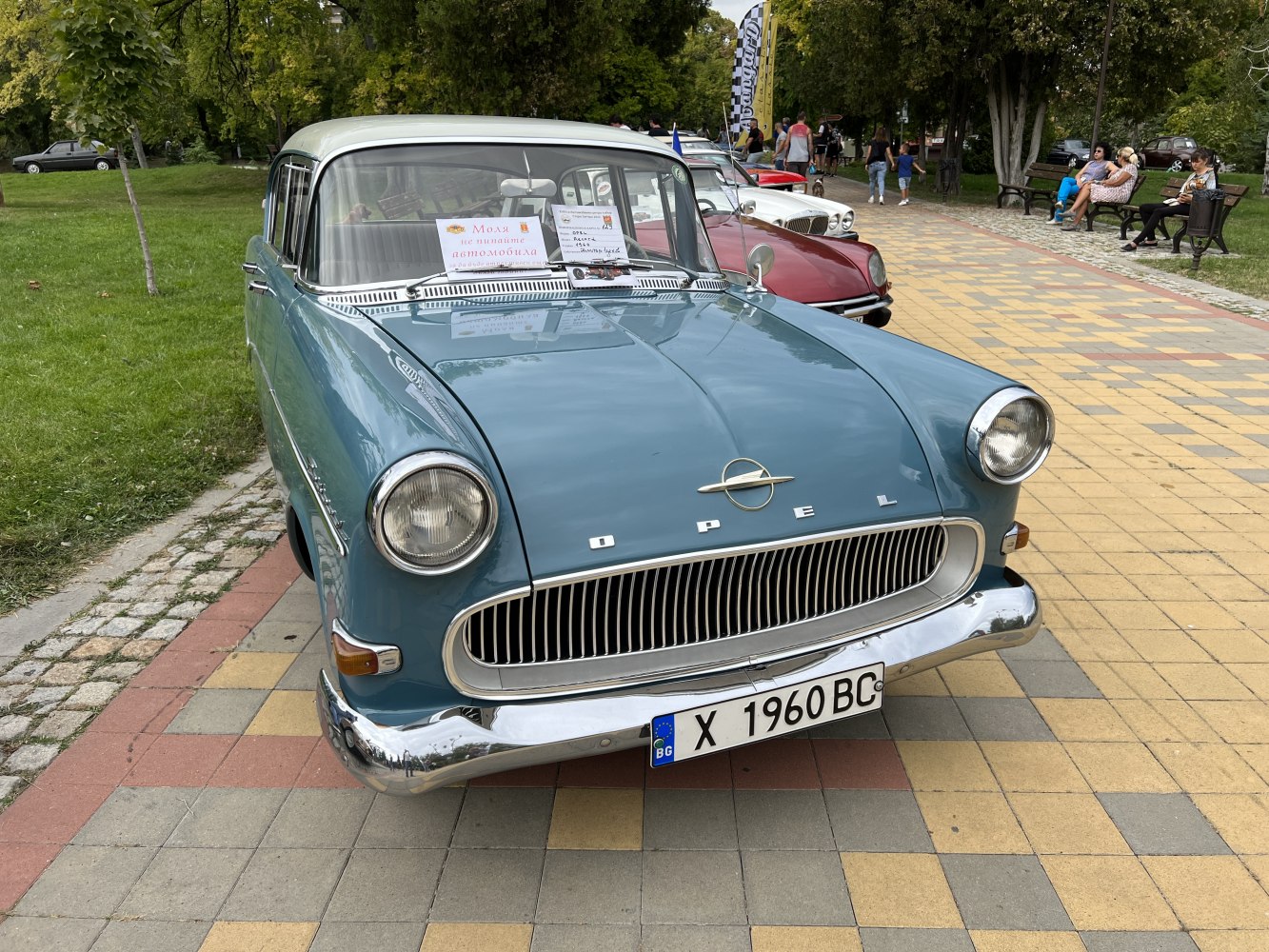 Rounded headlights and chrome grille on a vintage vehicle front.