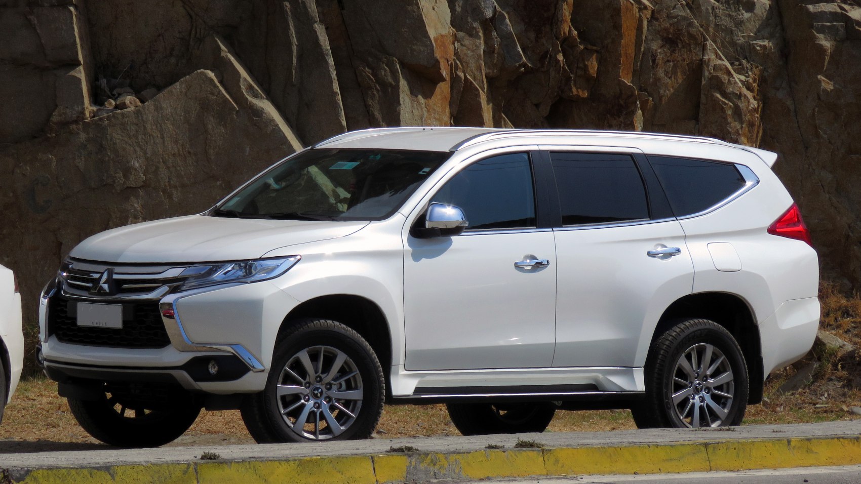 White SUV showing front and side profile with alloy wheels