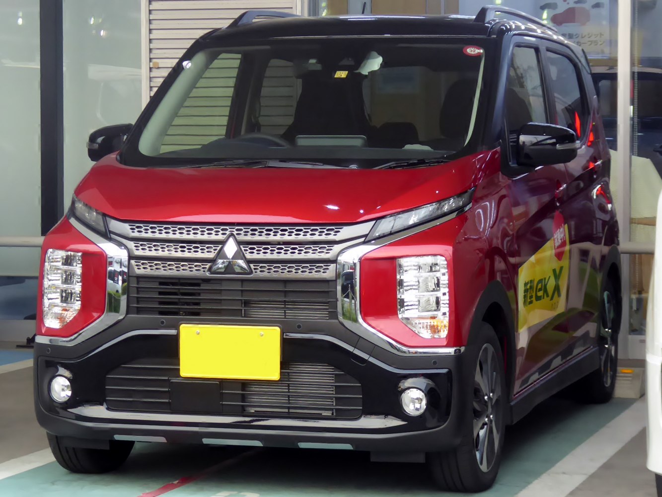 Distinctive front grille with split headlights and fog lamps on compact vehicle
