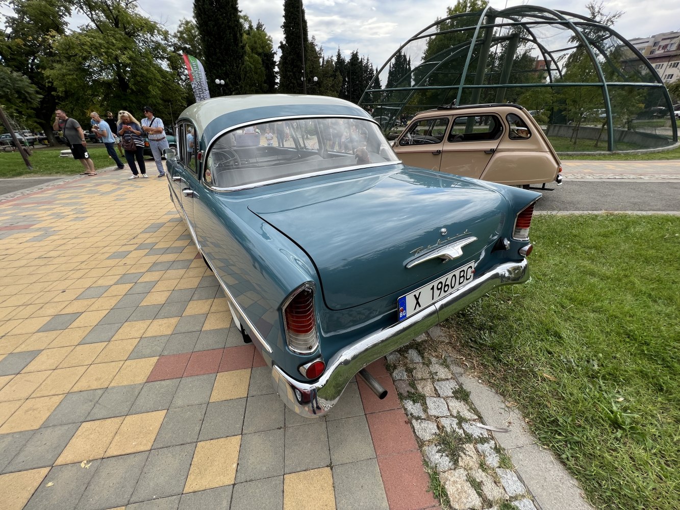 1950s classic sedan rear with chrome bumper and vertical taillights