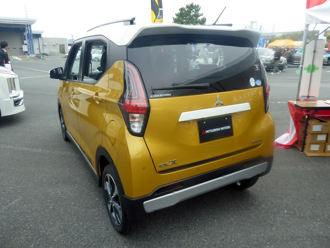 Rear view and taillight design of a yellow compact SUV