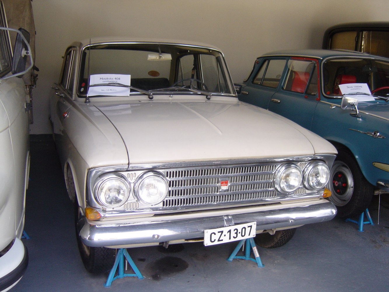 Front grille and dual round headlights of a vintage sedan