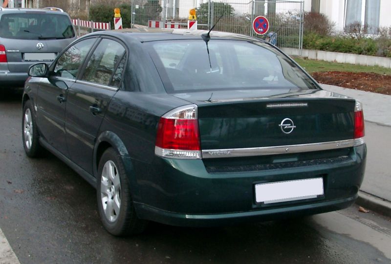 Rear view with tail lights, trunk, and rear bumper