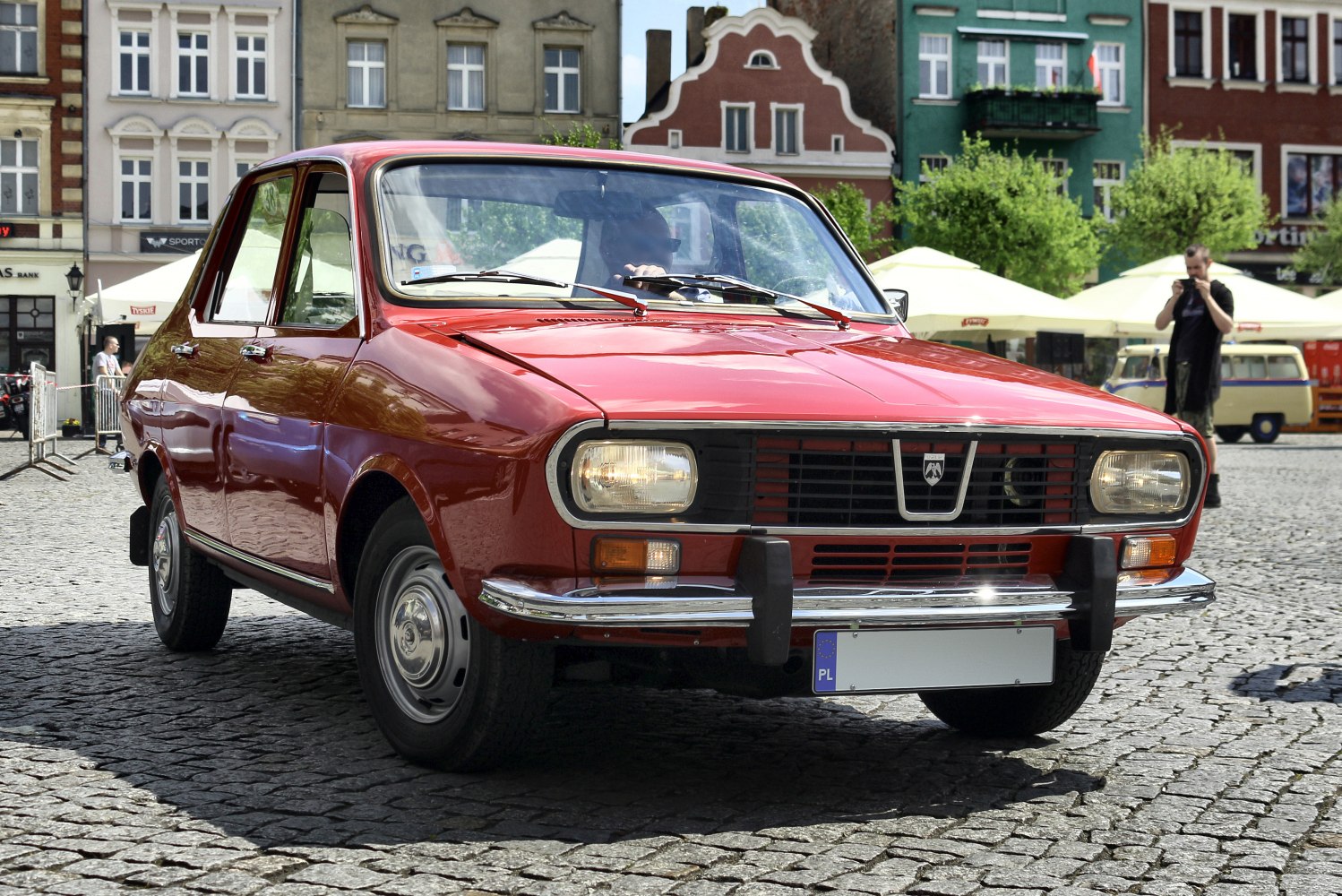 Front view of vintage classic sedan with rectangular headlights and grille