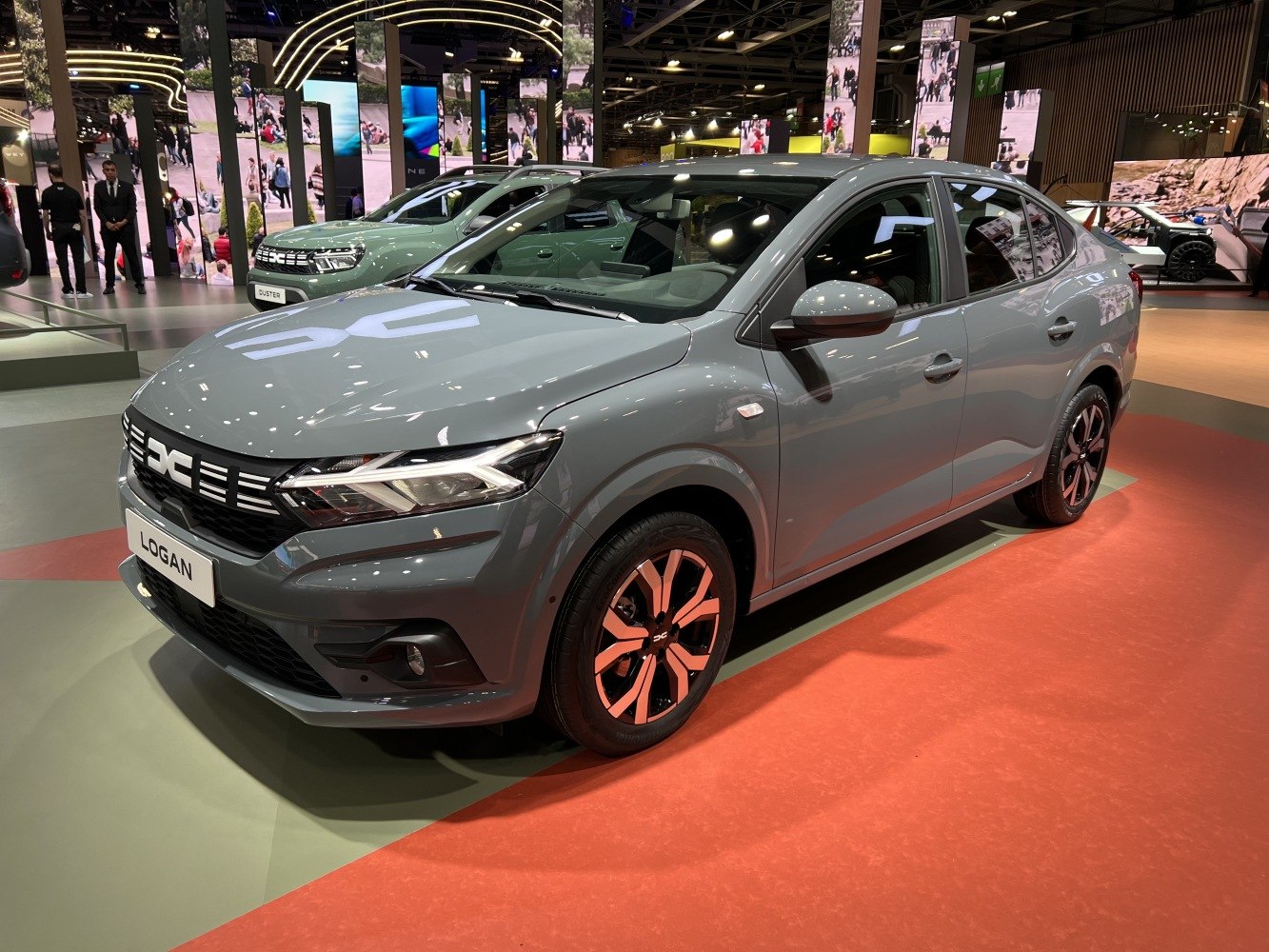 Front and side view of a modern sedan with distinctive headlights and alloy wheels