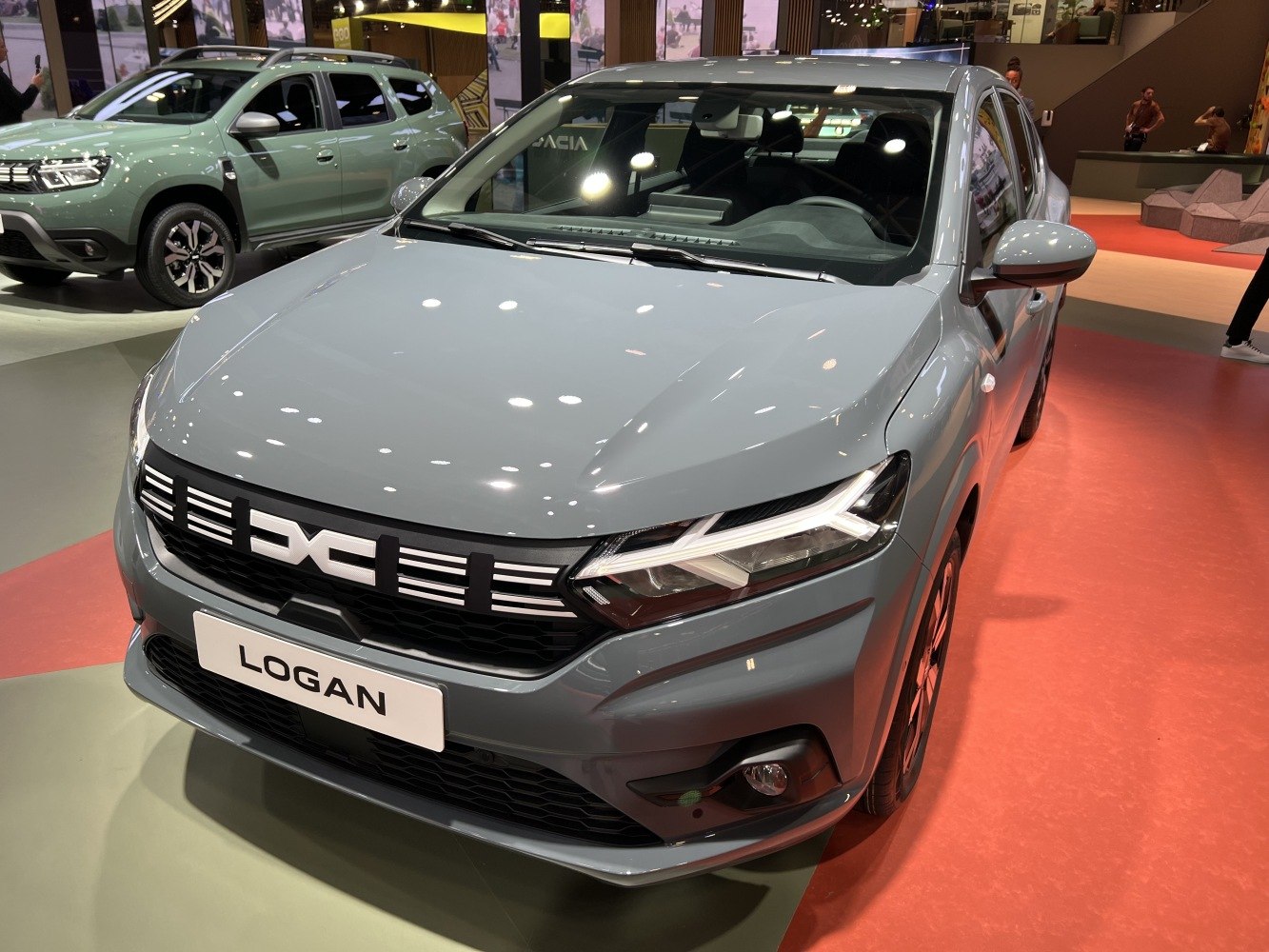 Modern sedan front with LED headlights and distinctive grill design