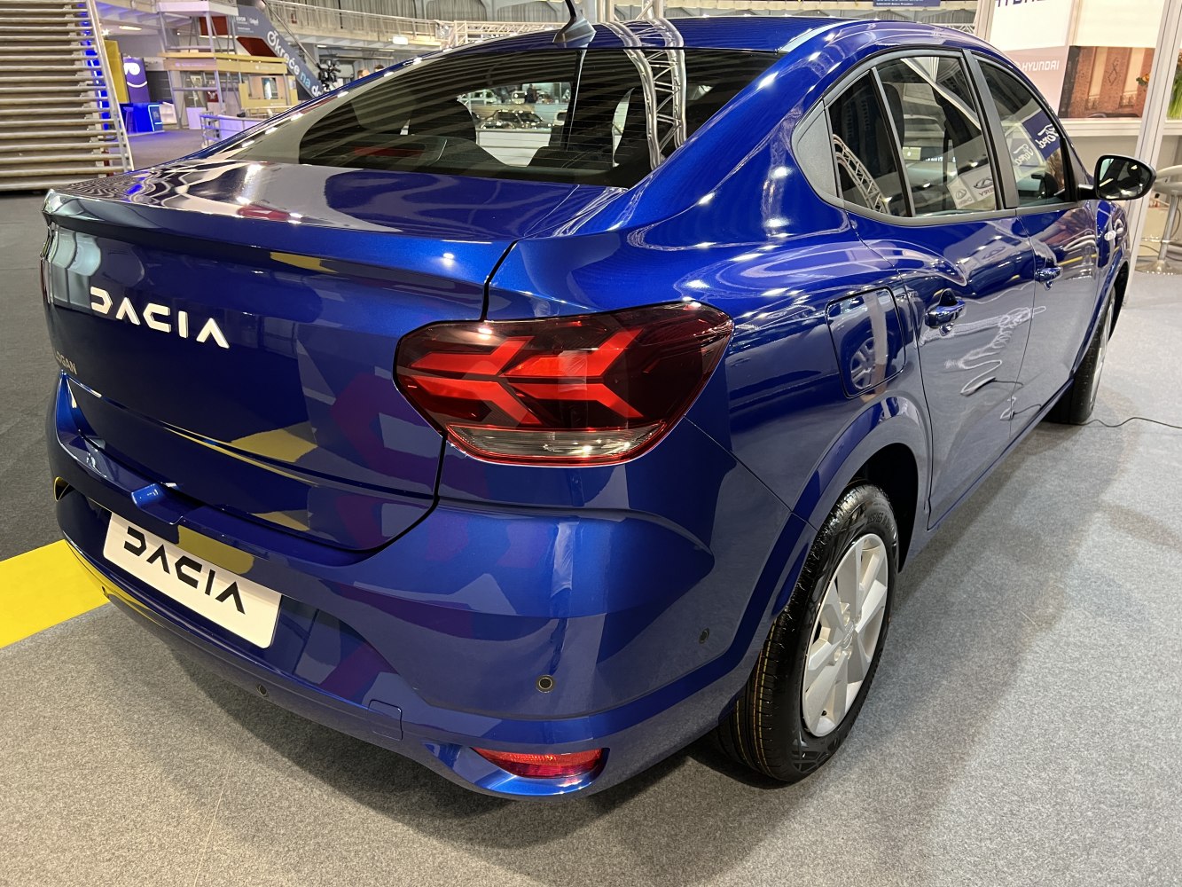 Blue sedan rear with LED tail lights and smooth bodywork