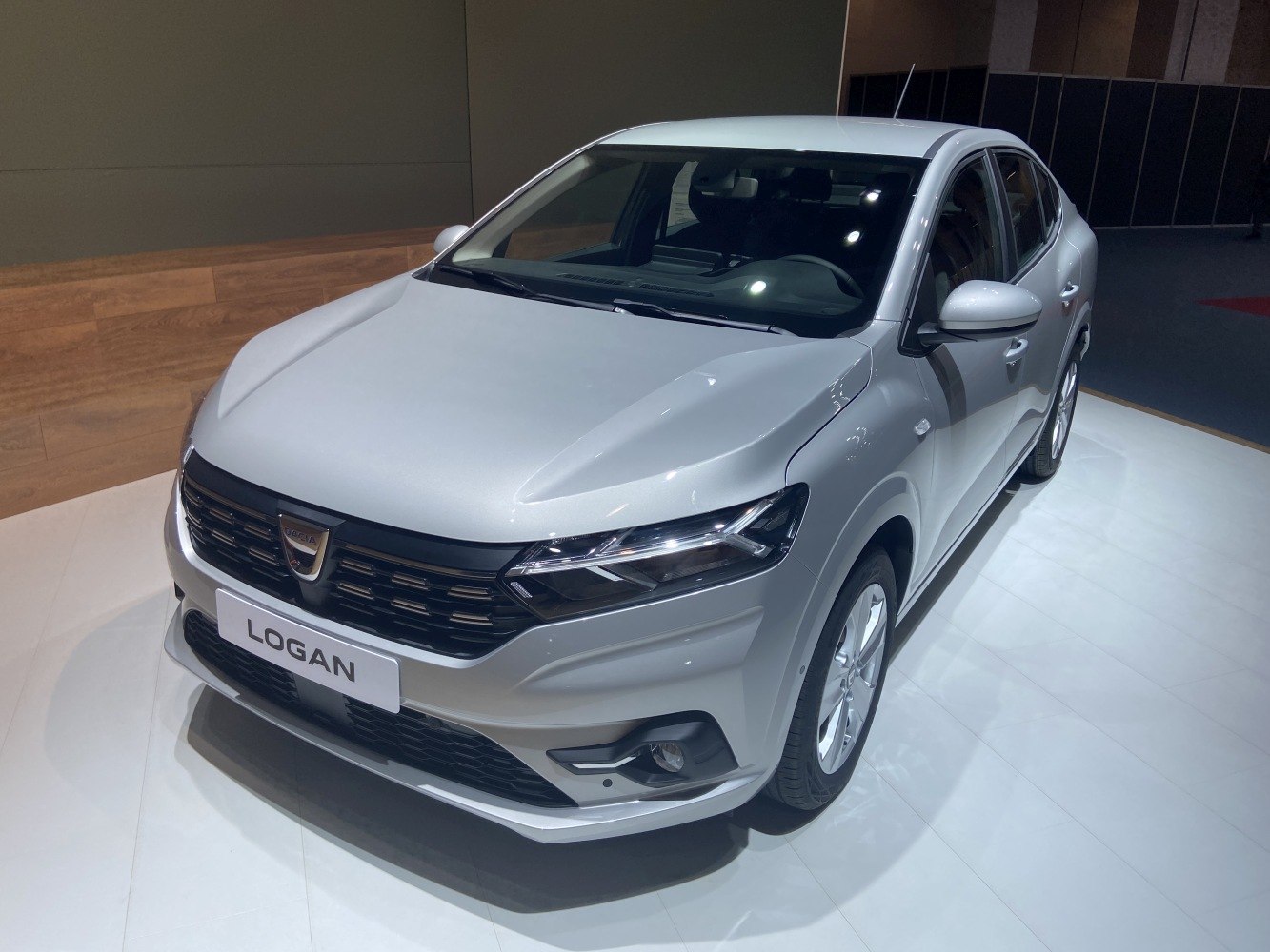 Front three-quarter view showcasing headlights and grille design.