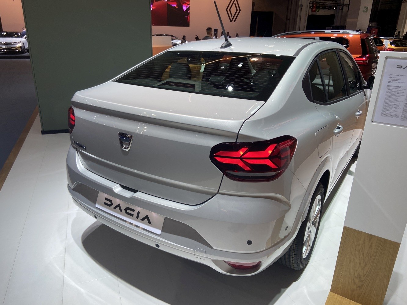 Rear view of sedan with illuminated modern tail lights and sleek trunk