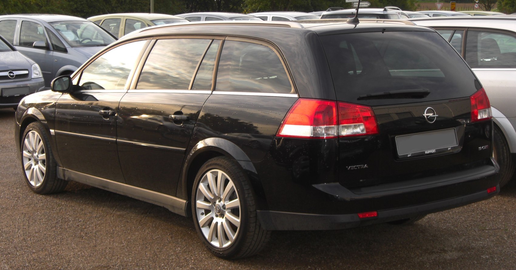 Rear and side view of a black wagon with alloy wheels.