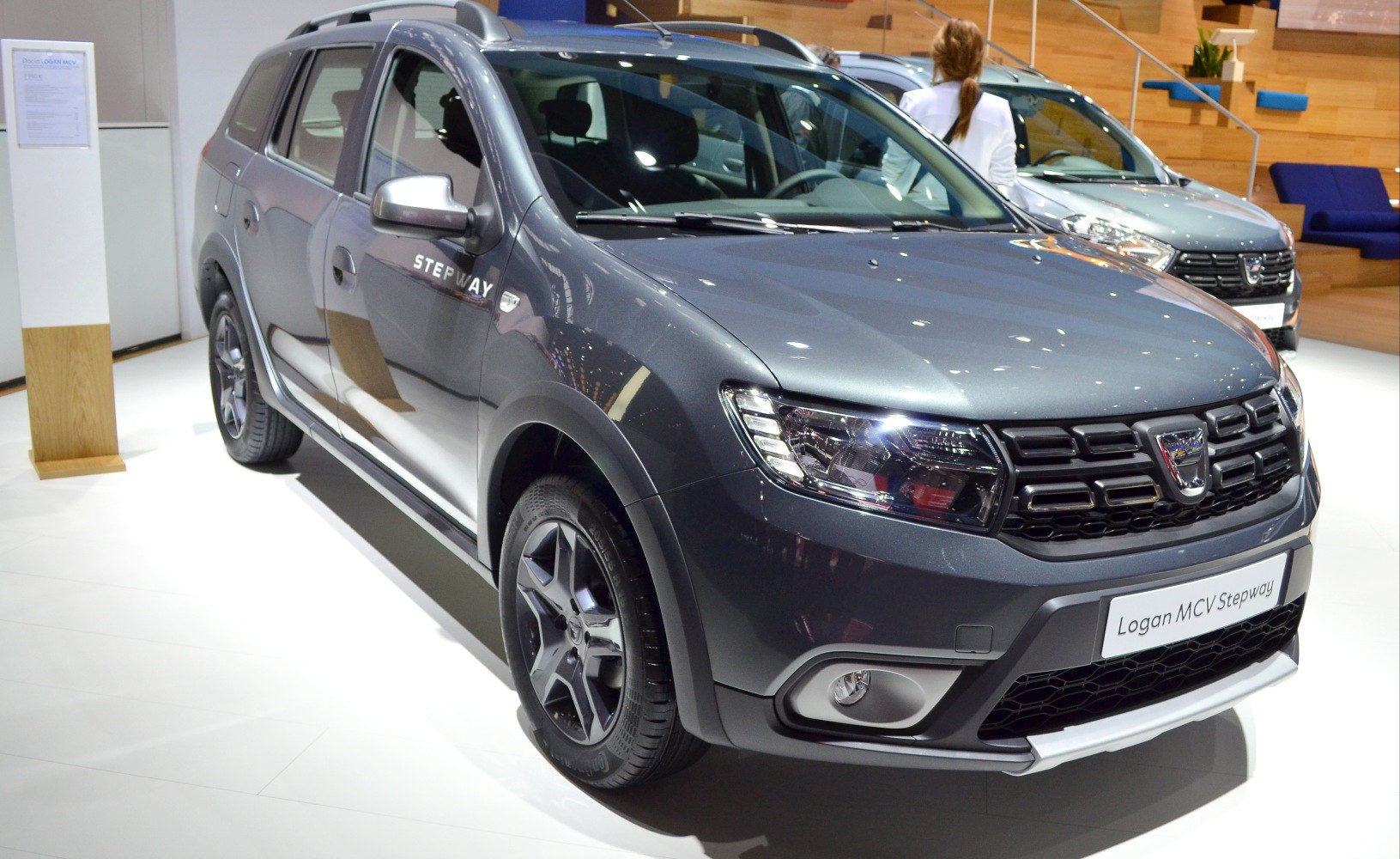 Front and side of rugged compact wagon with distinctive grille and headlights