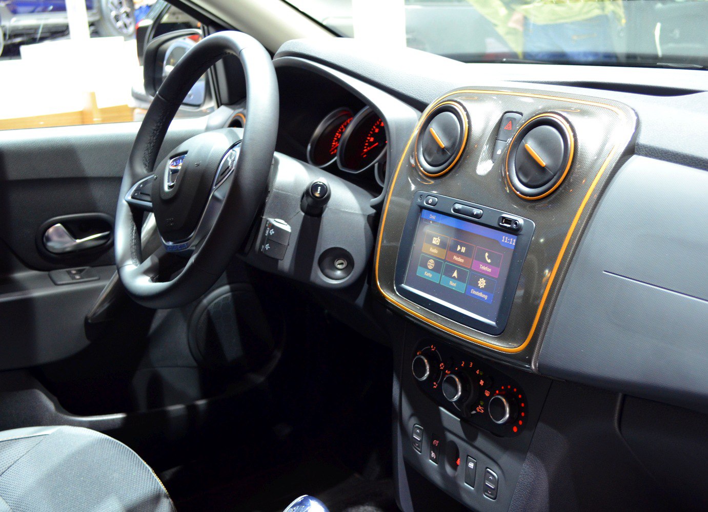 Dashboard with circular vents and infotainment screen