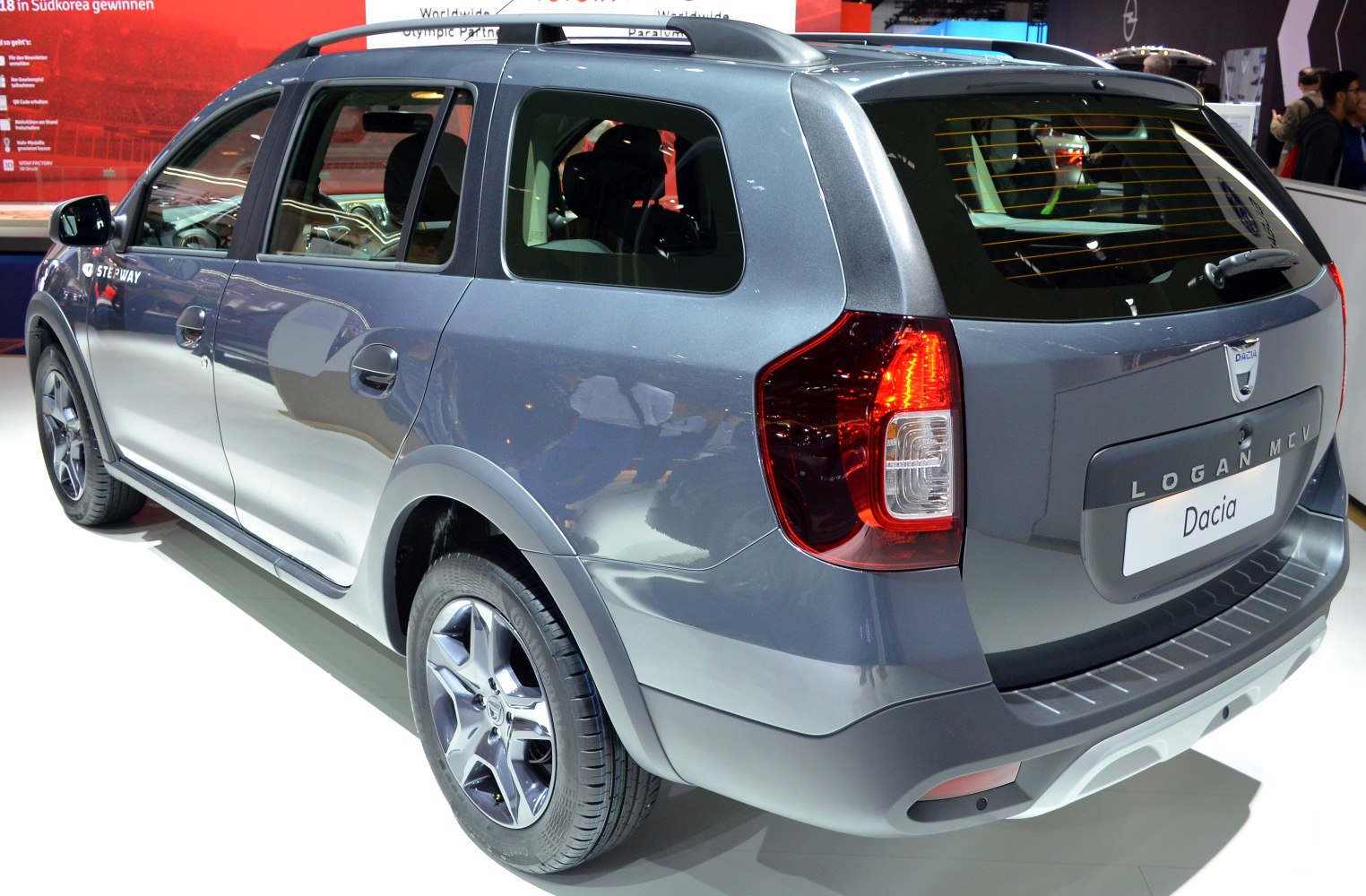 Rear and side view with taillights, alloy wheels, roof rails