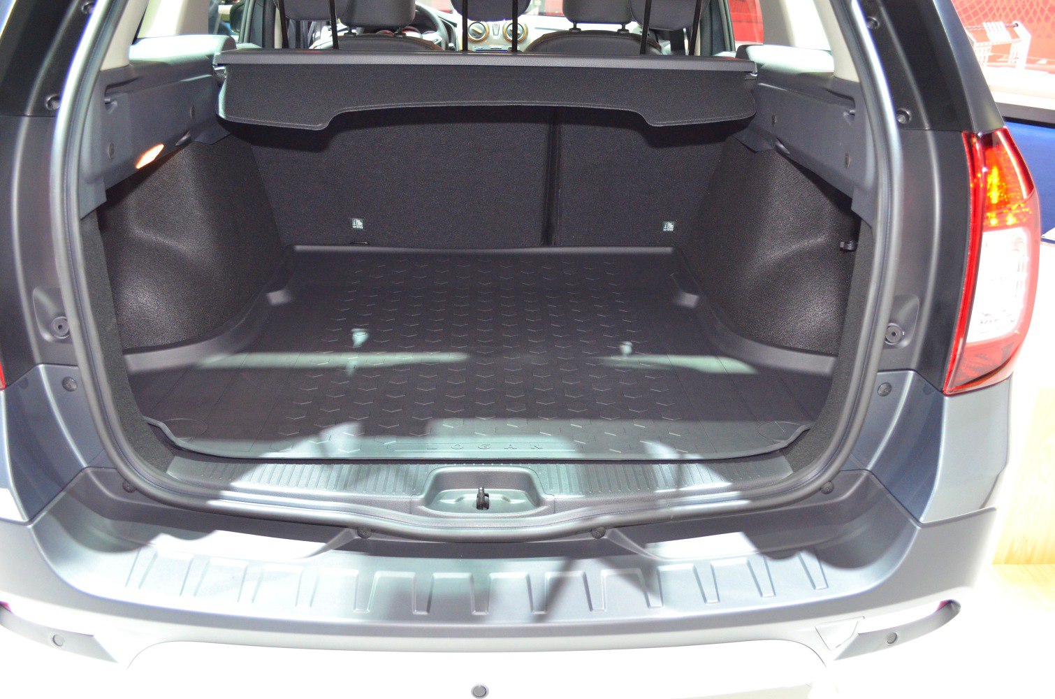 Spacious rear cargo area with protective mat.