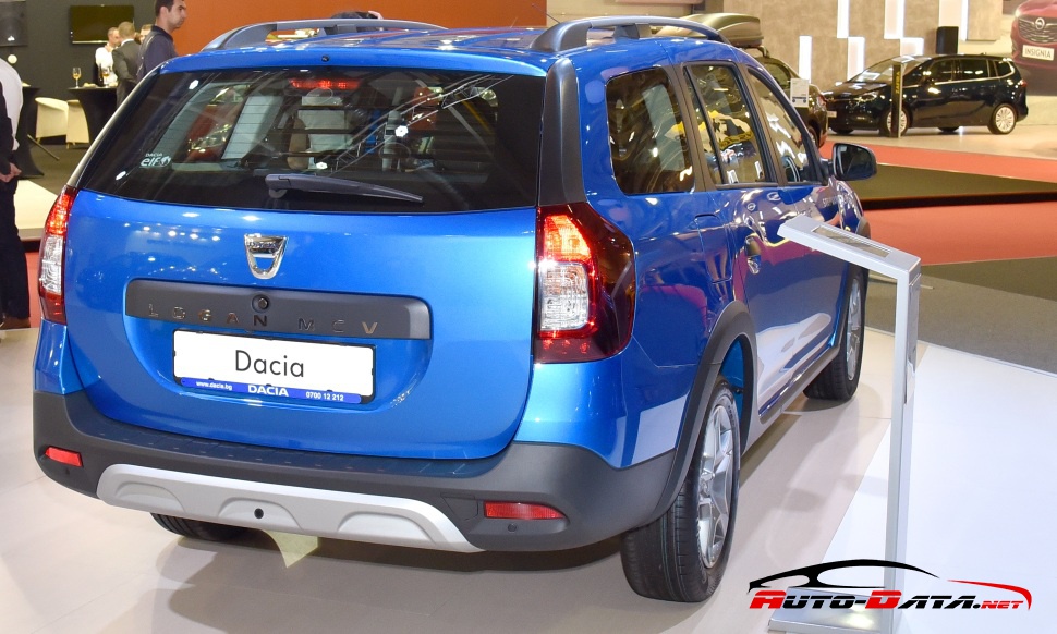 Rear view of a blue station wagon with roof rails and distinct tail lights