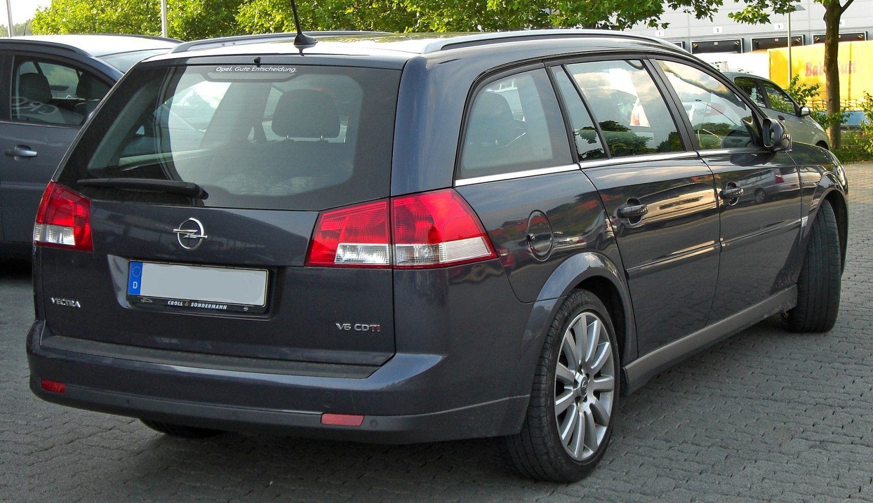 Rear view of station wagon with distinct taillights and alloy wheels