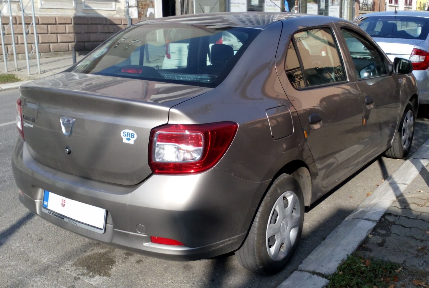 Compact sedan rear with taillights and trunk lid