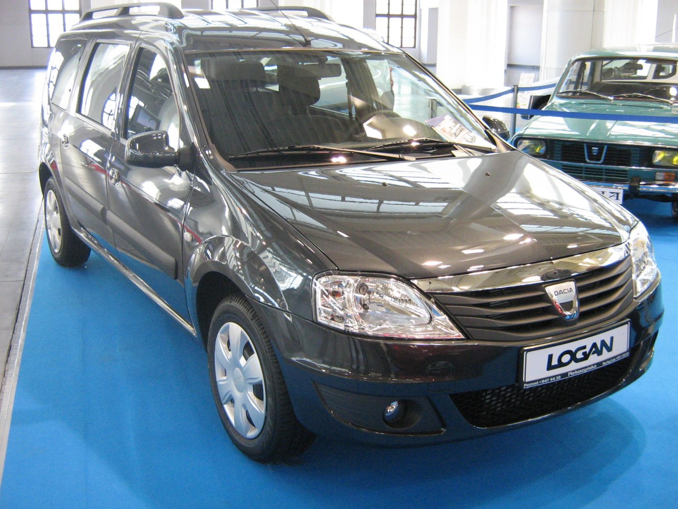 Front-side view of facelifted station wagon with clear headlights and grille.