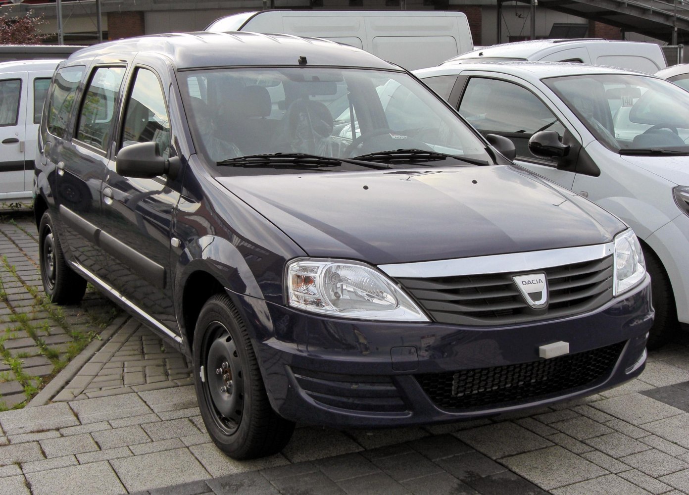 Front and side view of a compact multi-purpose vehicle with distinctive grille and headlights