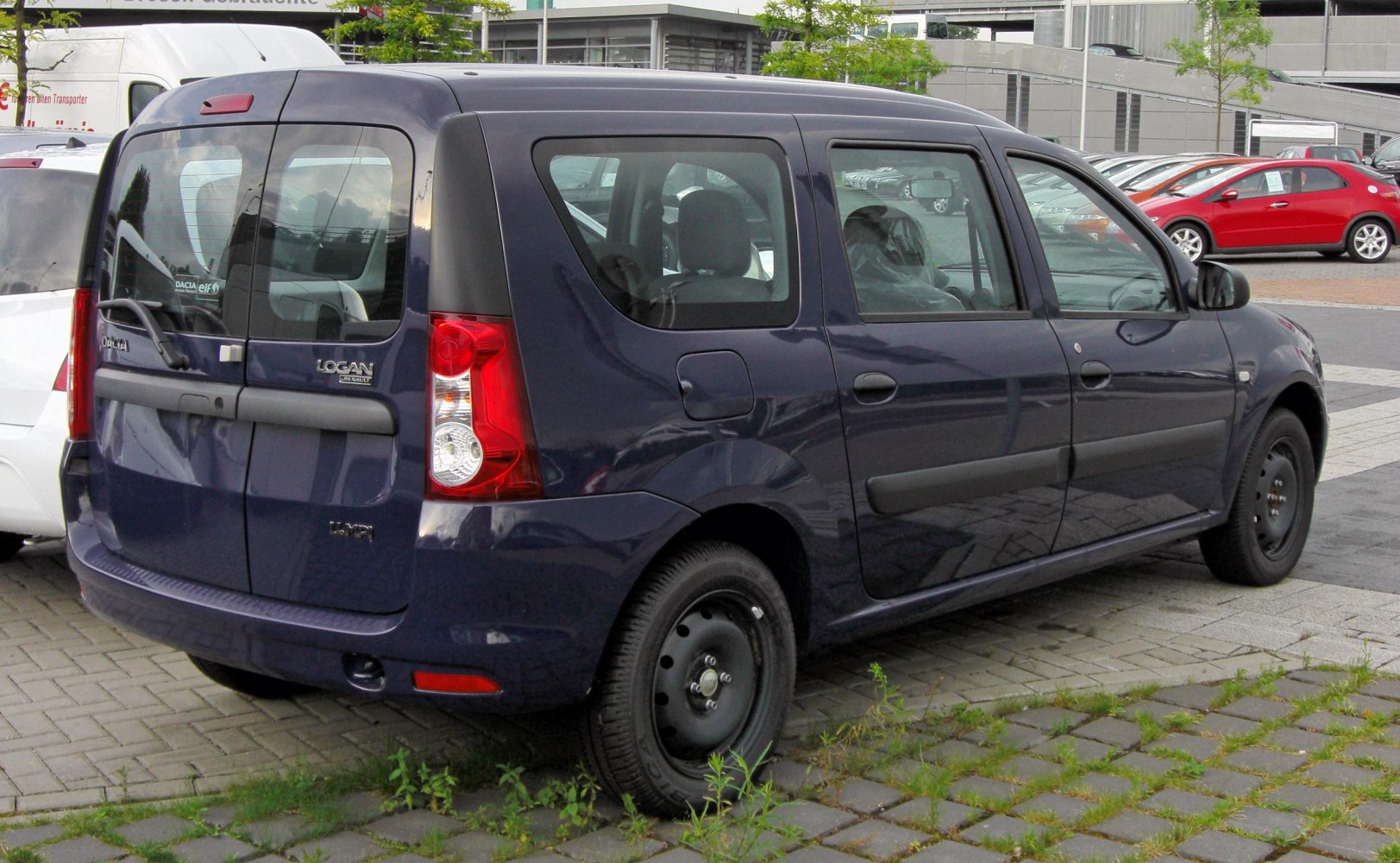 Rear and side view with distinctive tail lights and panel design
