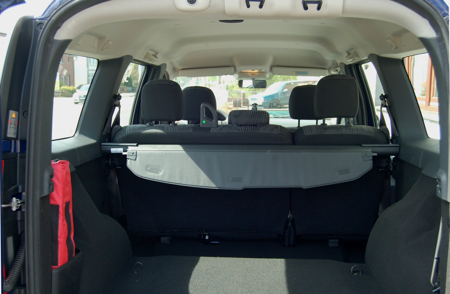 Cargo space with privacy cover and rear seats visible