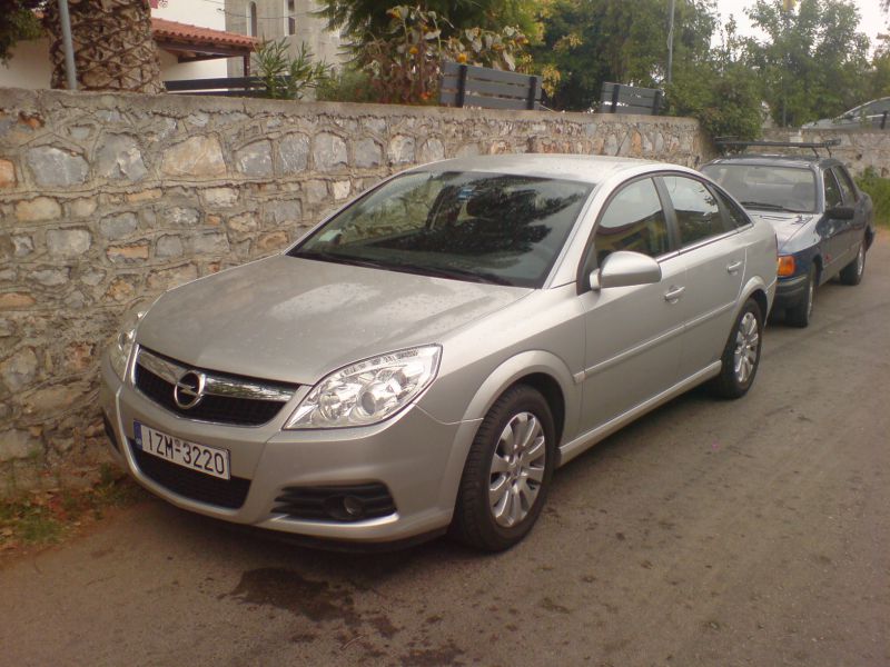 Silver sedan front 3/4 view with updated headlights and grille