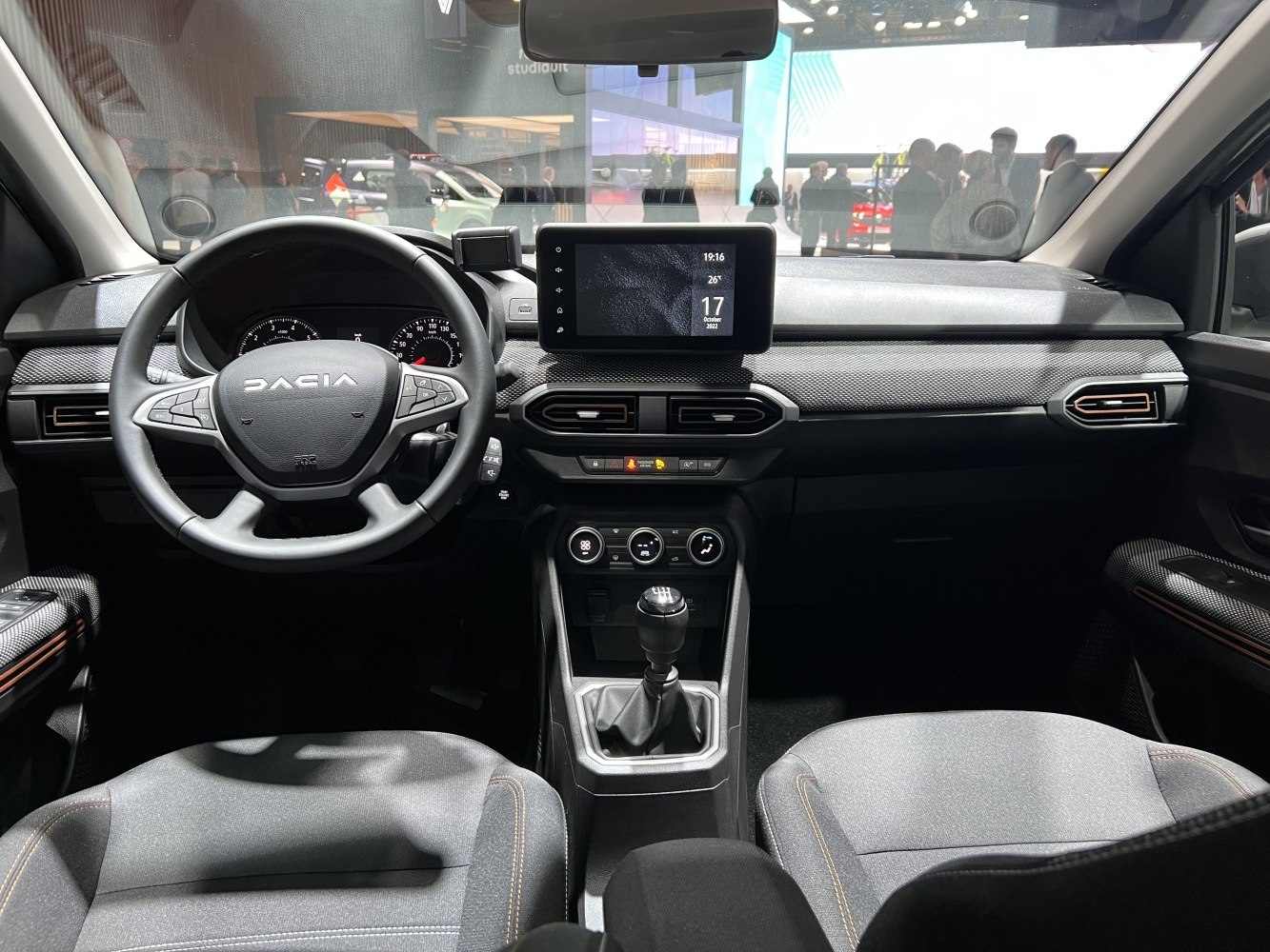 Dashboard, steering wheel, infotainment screen, manual gear shift
