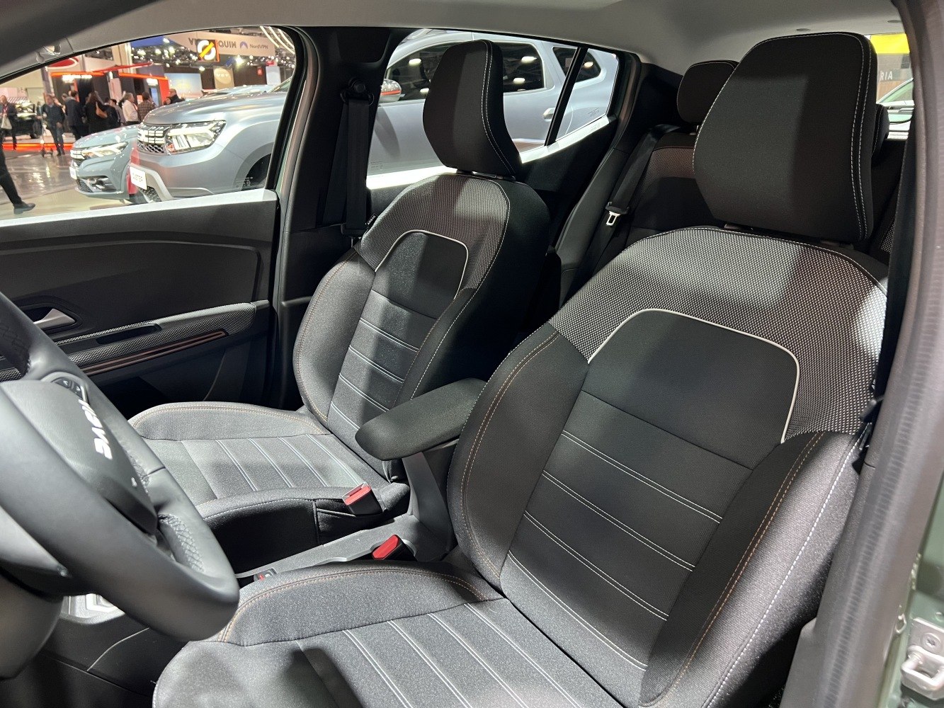 Front seats with patterned upholstery and central armrest