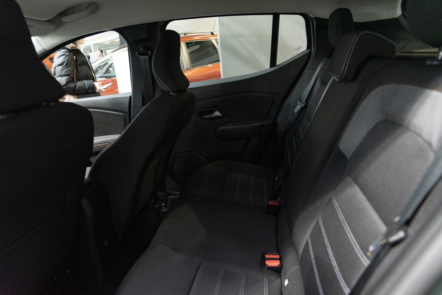 Spacious rear seats with black upholstery and safety belts