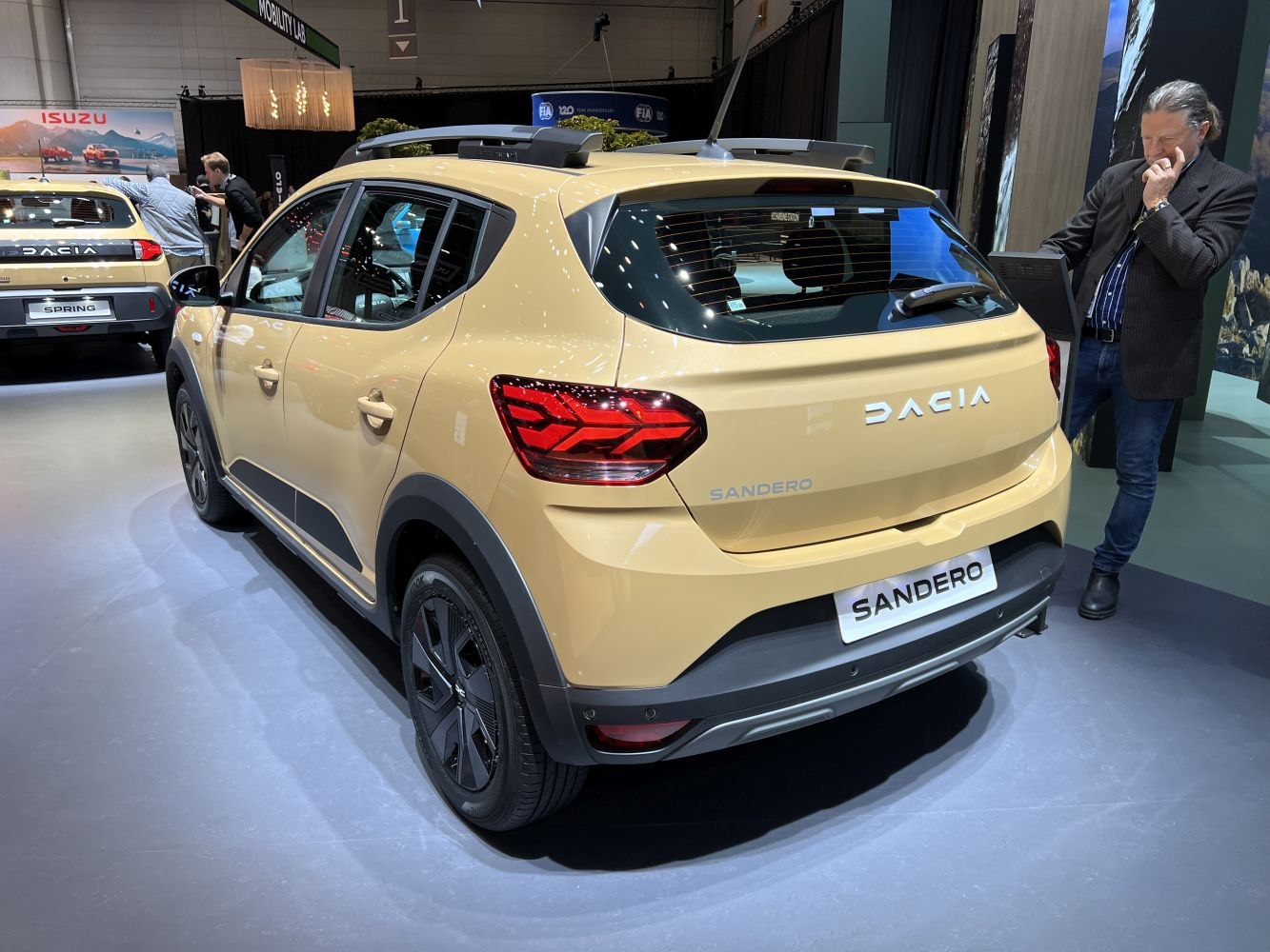 Rear and side view of modern compact crossover with distinctive taillights and roof rails