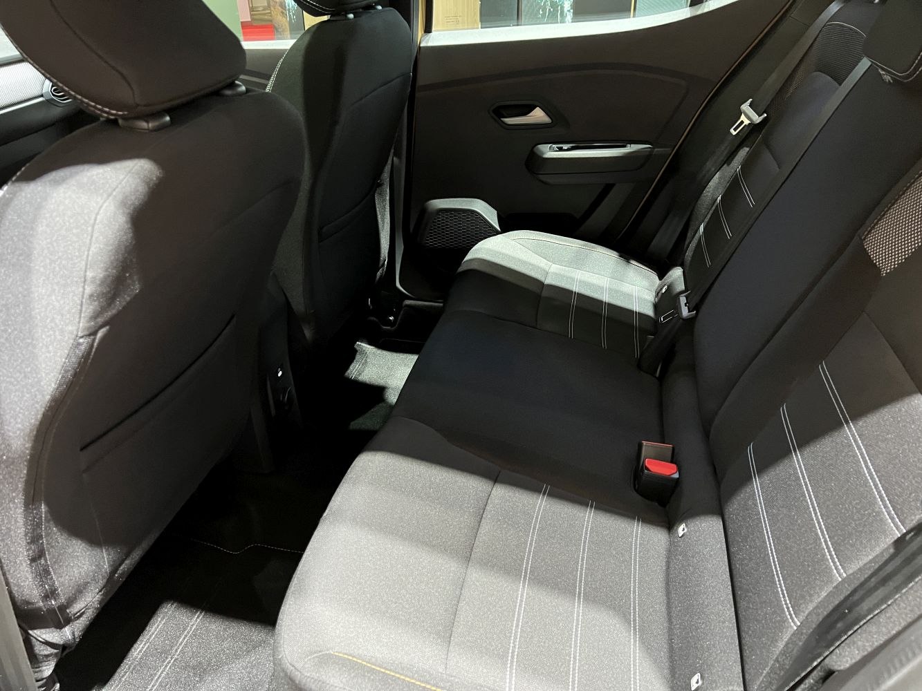 Spacious and modern rear seat interior with fabric upholstery