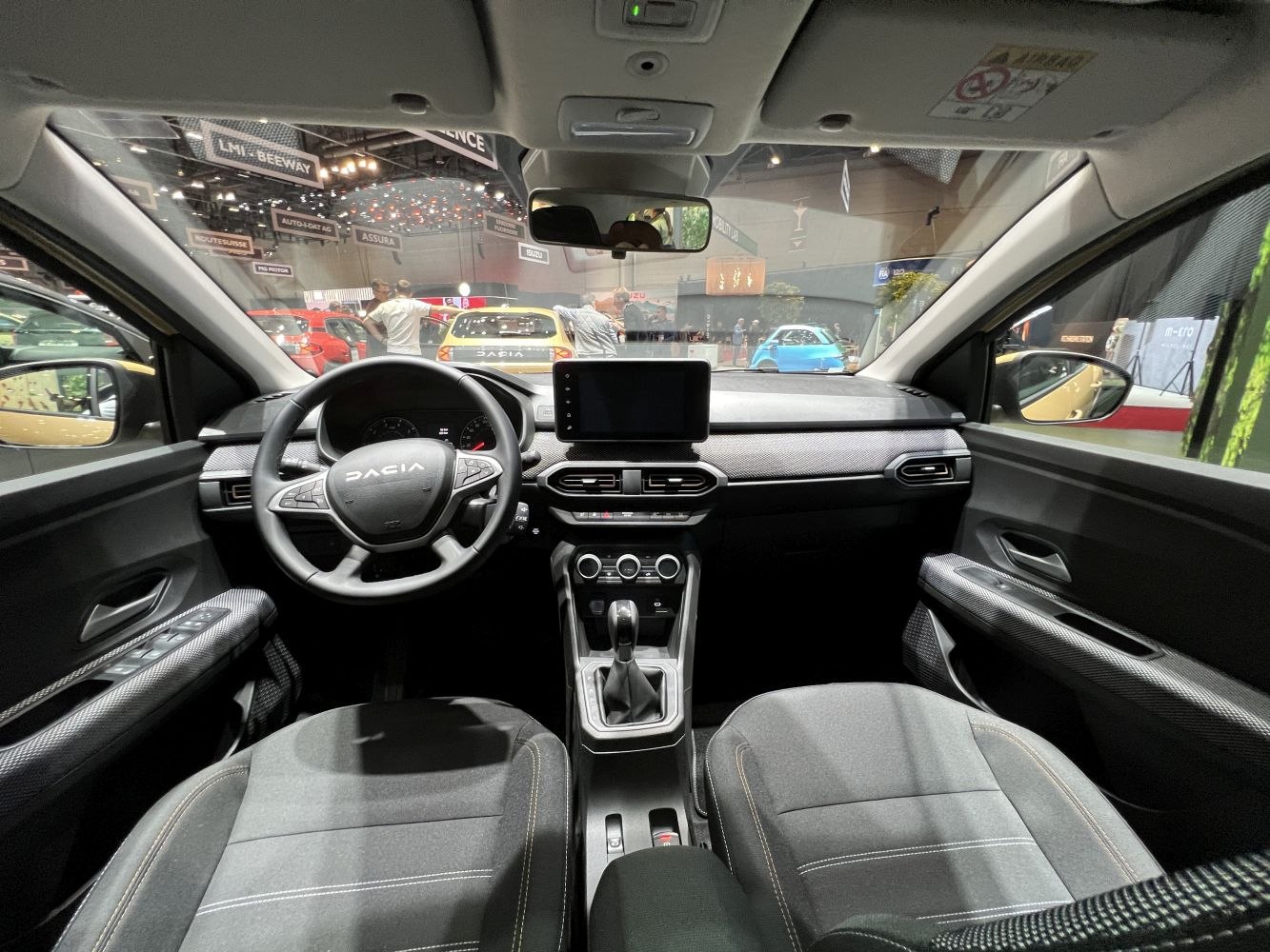 Modern car interior with dashboard, steering wheel, infotainment screen