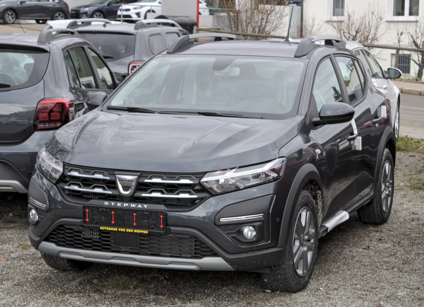 Front view with grille, headlights, roof rails, and rugged styling