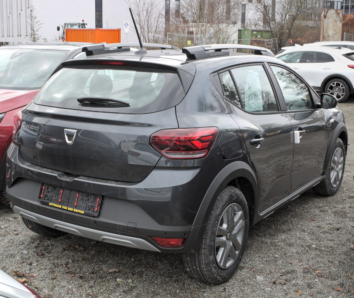 Rear and side view showing taillights, roof rails, and wheels