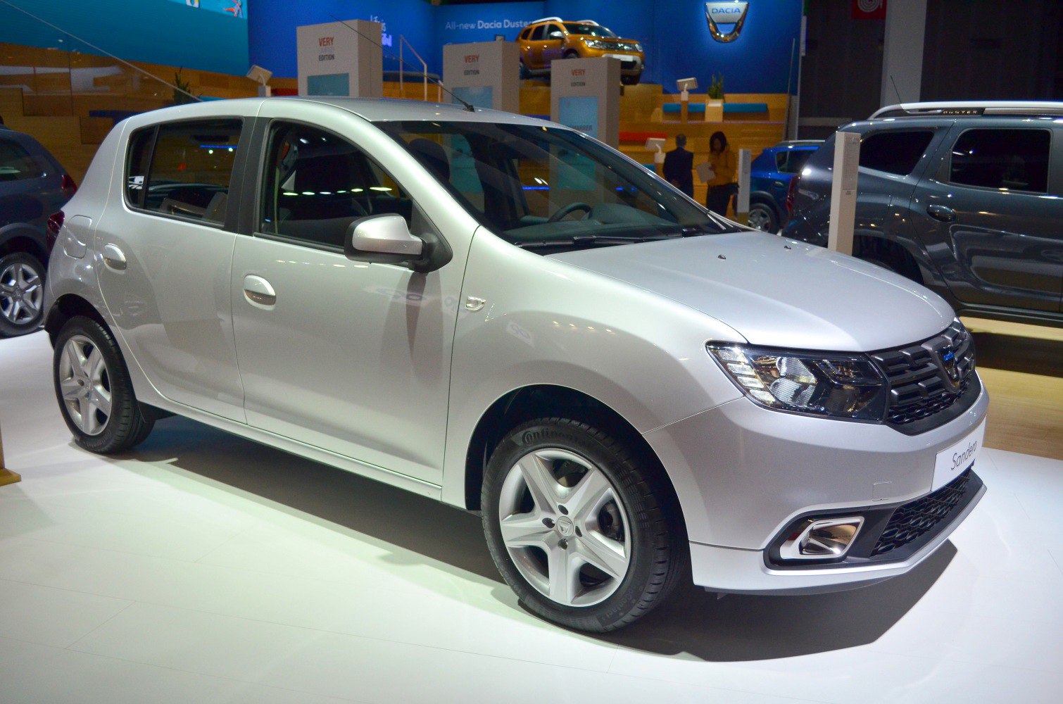 Silver compact hatchback with modern headlights and alloy wheels