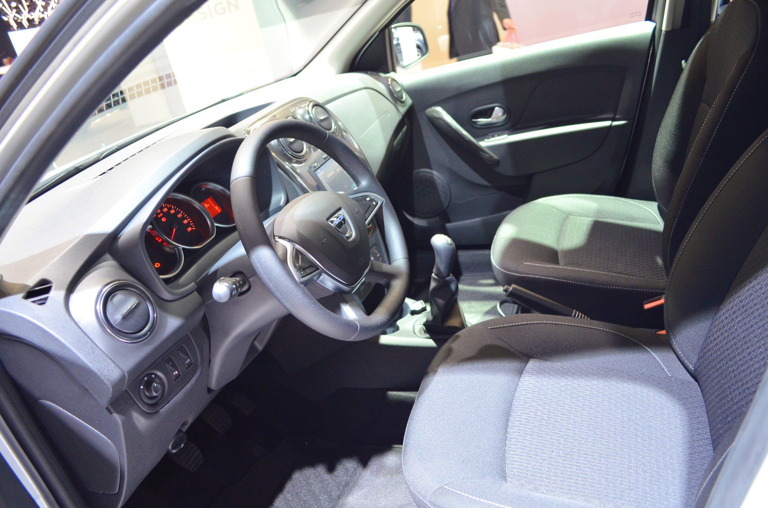 Steering wheel, dashboard, and front seats interior view