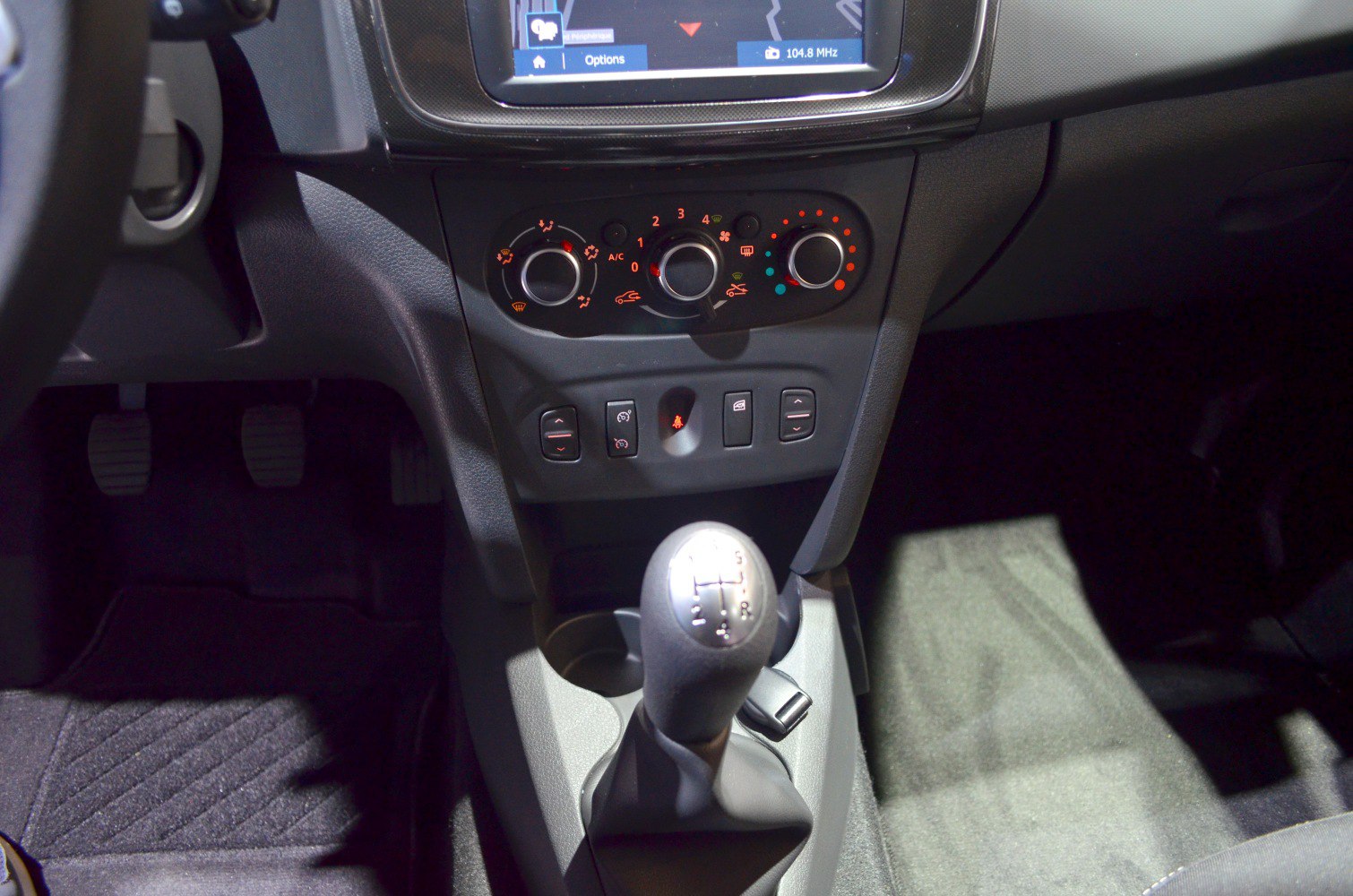 Manual gear shift lever and climate control knobs on dashboard