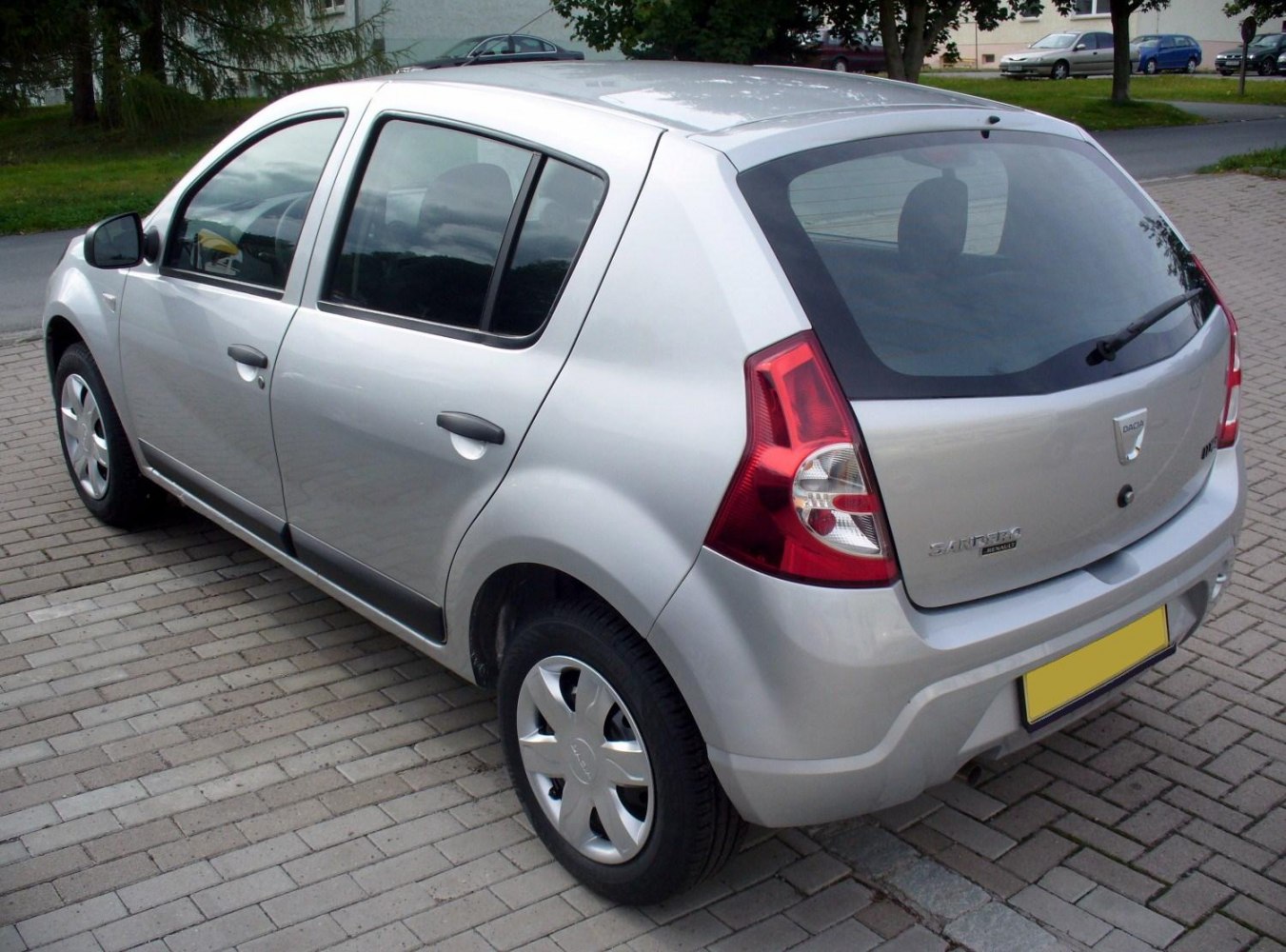 Rear and side view of a silver five-door hatchback with distinctive rear lights