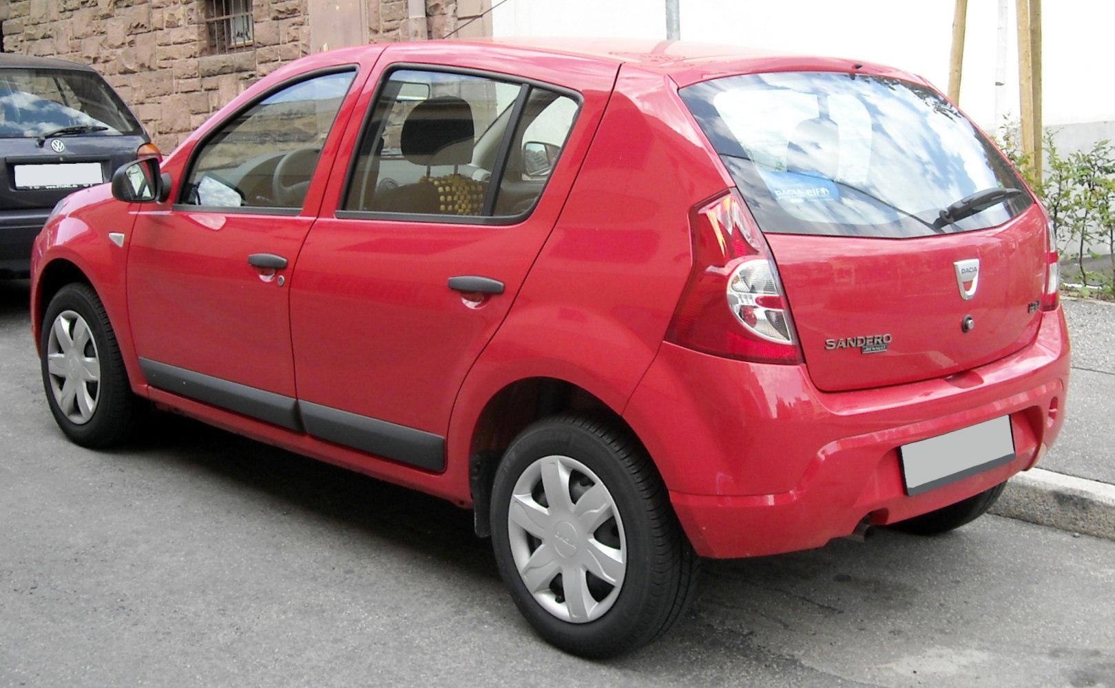 Rear side view of a compact hatchback with distinct taillights and four doors