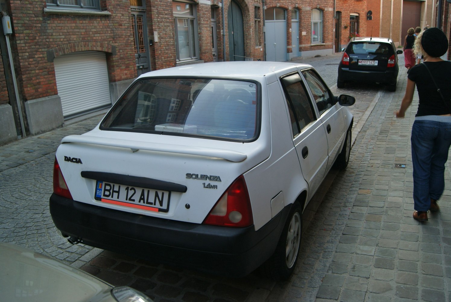 Rear view of sedan with spoiler and red tail lights