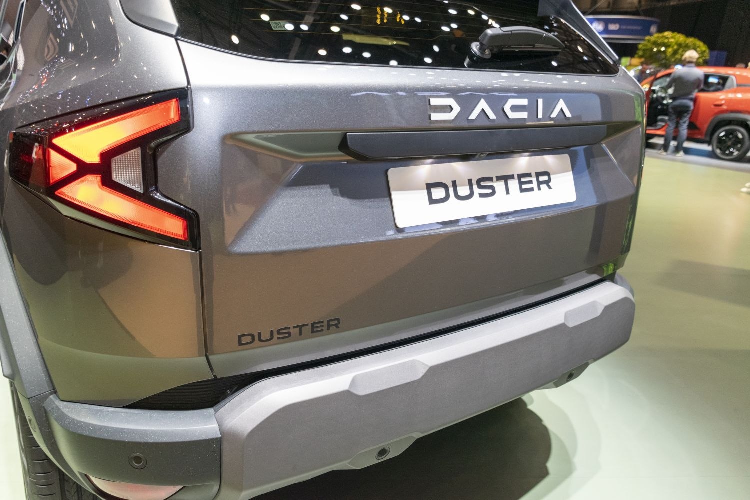 Illuminated angular taillight and rear bumper in close-up