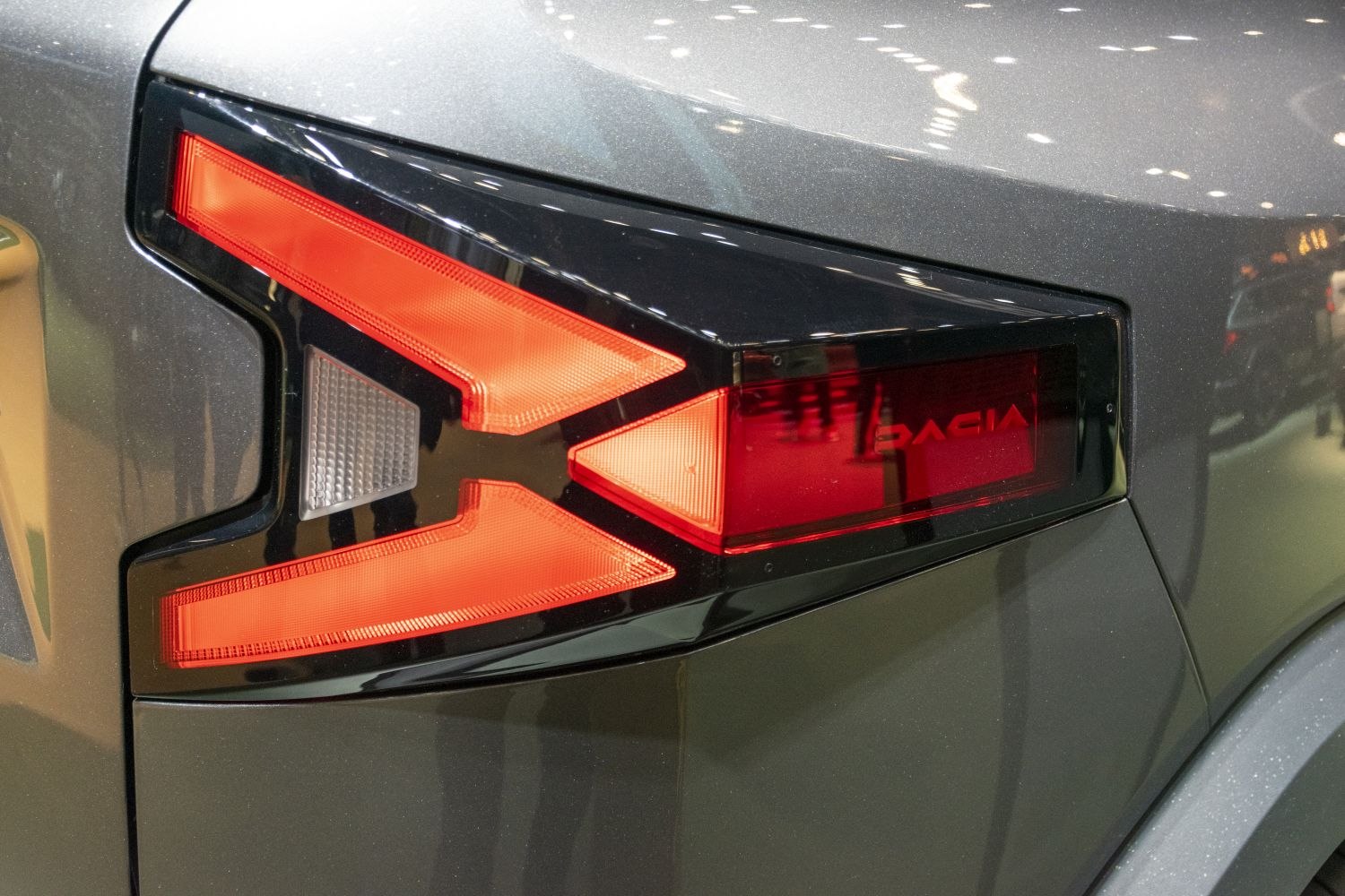 Angular LED rear taillight with black housing trim and red lens