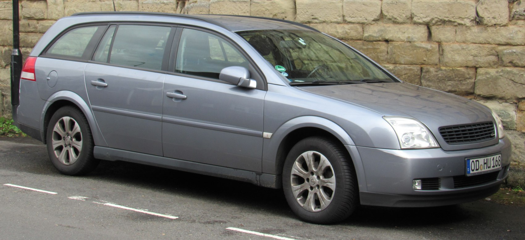 Silver station wagon with alloy wheels and prominent headlights