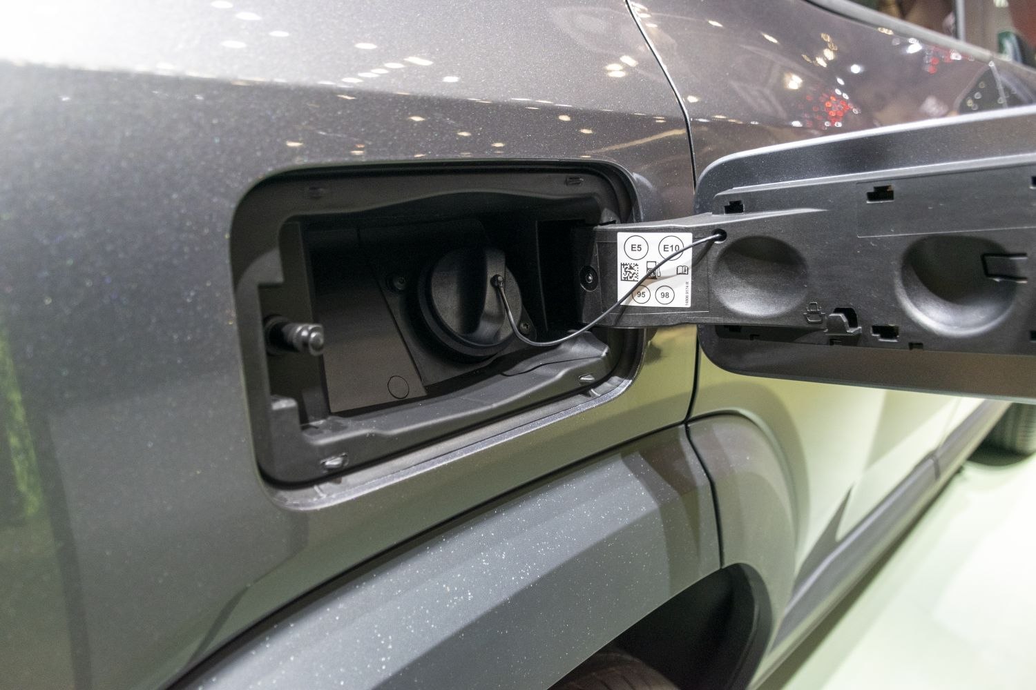 Fuel cap and open fuel door with fuel type labels