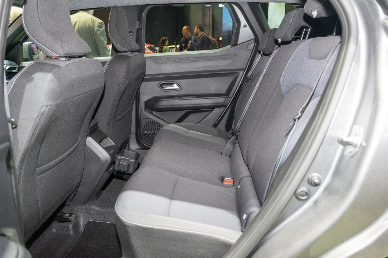 Spacious rear seat interior with fabric upholstery and seat belts