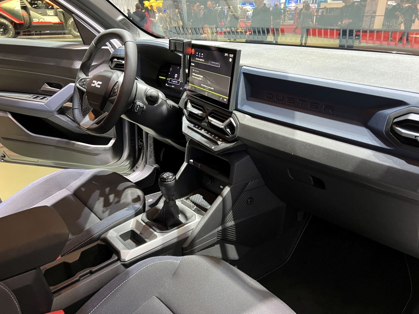 Digital dashboard, touchscreen infotainment, manual transmission inside vehicle