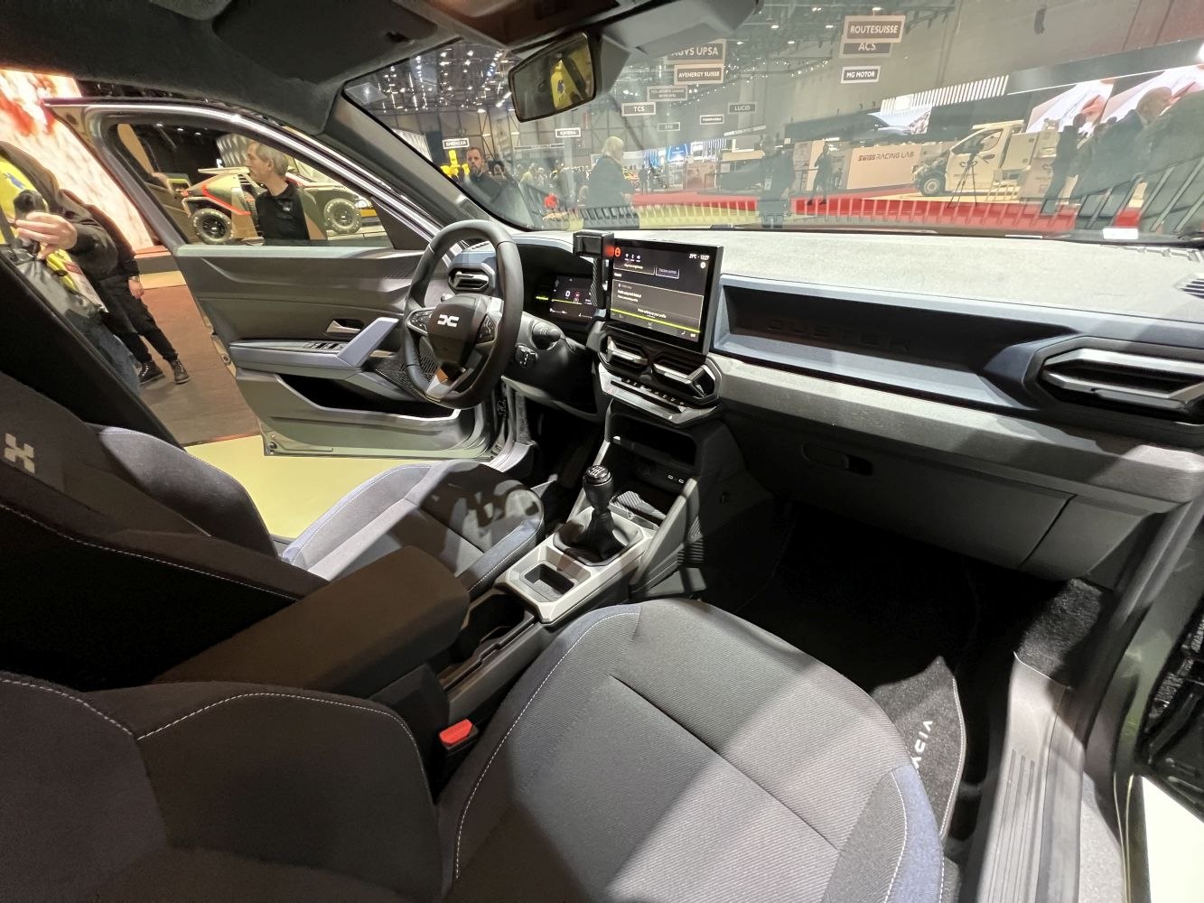 Modern car interior with digital dashboard and manual gear shift