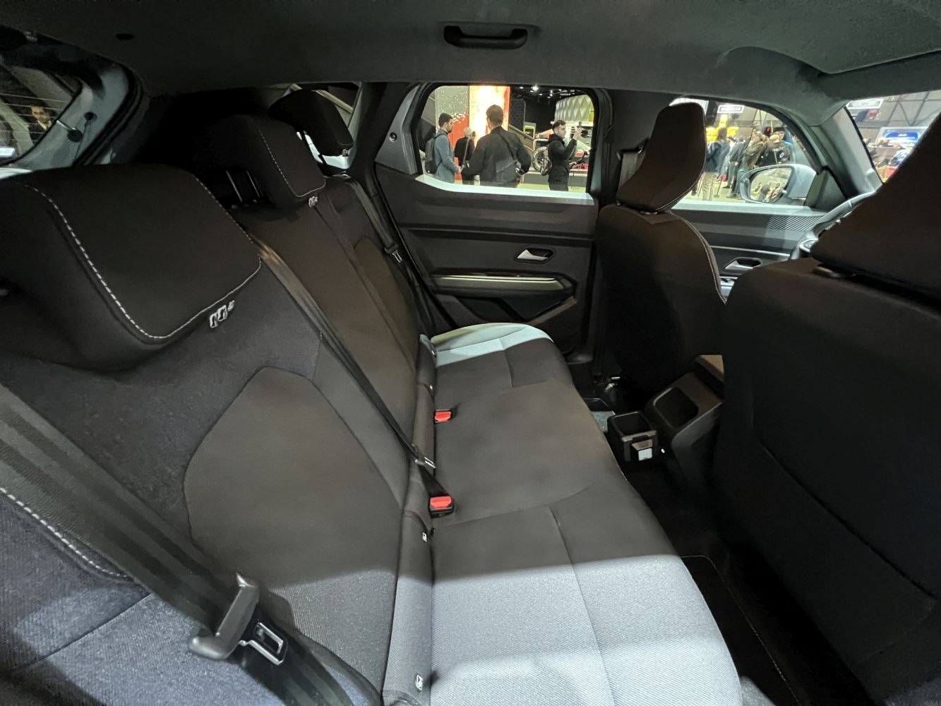Rear seat interior with fabric upholstery and three-point seat belts