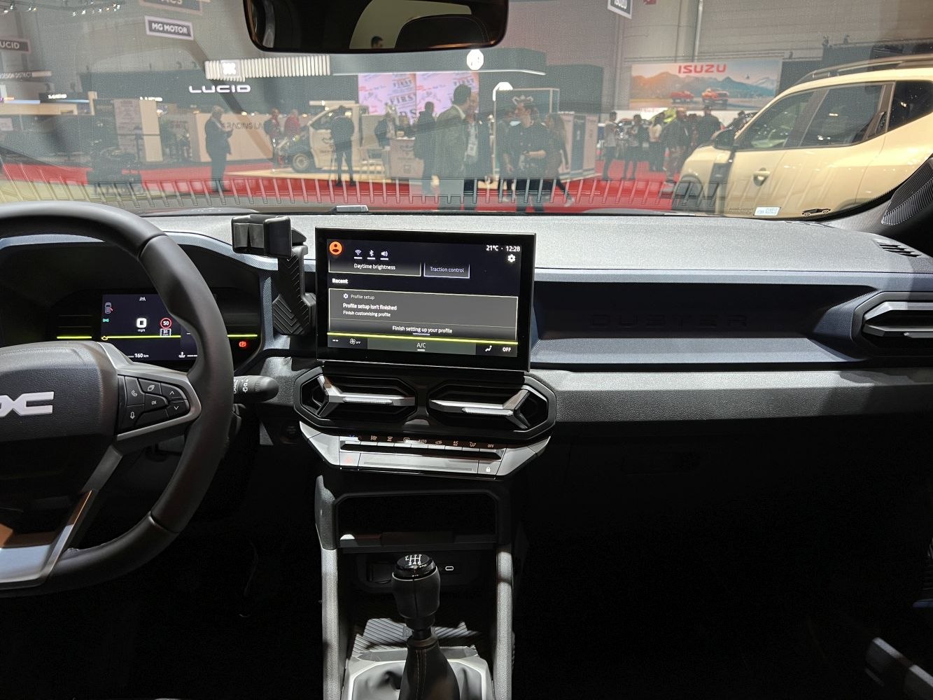 Car interior with touchscreen infotainment and manual gear stick